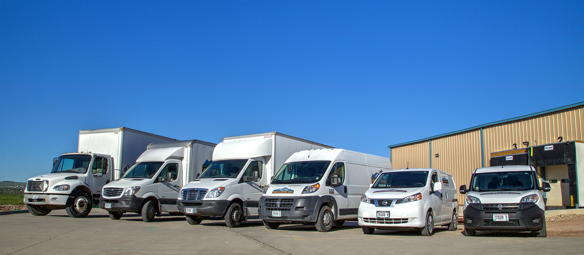 Photo of Black Hills Chemical & Janitorial Supply delivery vehicles. 
